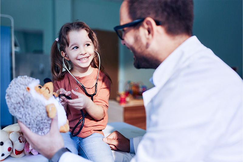 When to See a Doctor | Picture of a little girl talking to a male doctor